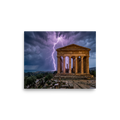 'Wrath of Olympus' — a Art photography print. A breathtaking photograph of violet lightning bolts striking behind an ancient classical temple ruin overlooking the sea, perfect for a dramatic study or living room.