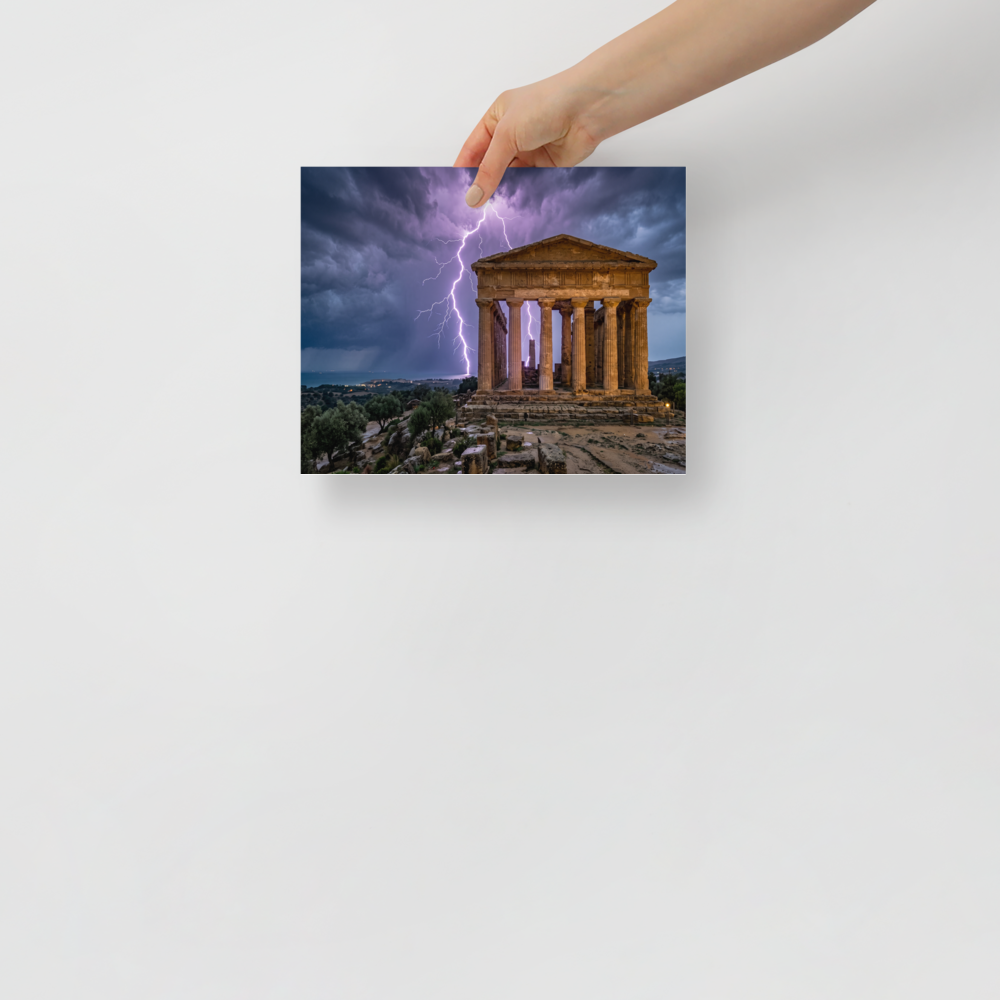 'Wrath of Olympus' — a Art photography print. A breathtaking photograph of violet lightning bolts striking behind an ancient classical temple ruin overlooking the sea, perfect for a dramatic study or living room.