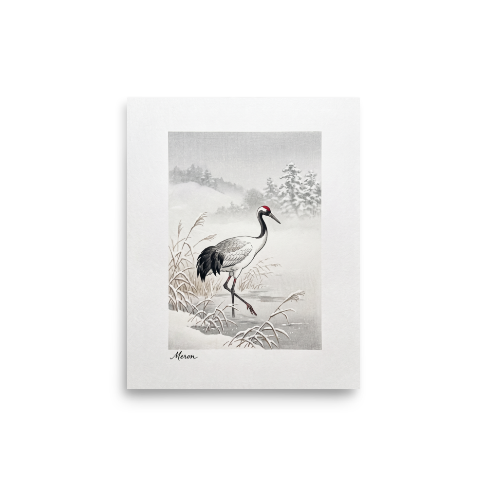 'Crane in the Frost' — a Shin hanga print. A red-crowned crane wades through a snow-covered winter marsh near frosted pine hills, adding a calm atmosphere to a bedroom.