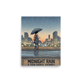 'Midnight Rain' — a Shin hanga print. A woman holding an umbrella stands on a terrace looking toward a rainy city skyline at dusk above typography reading Midnight Rain, perfect for a living room.