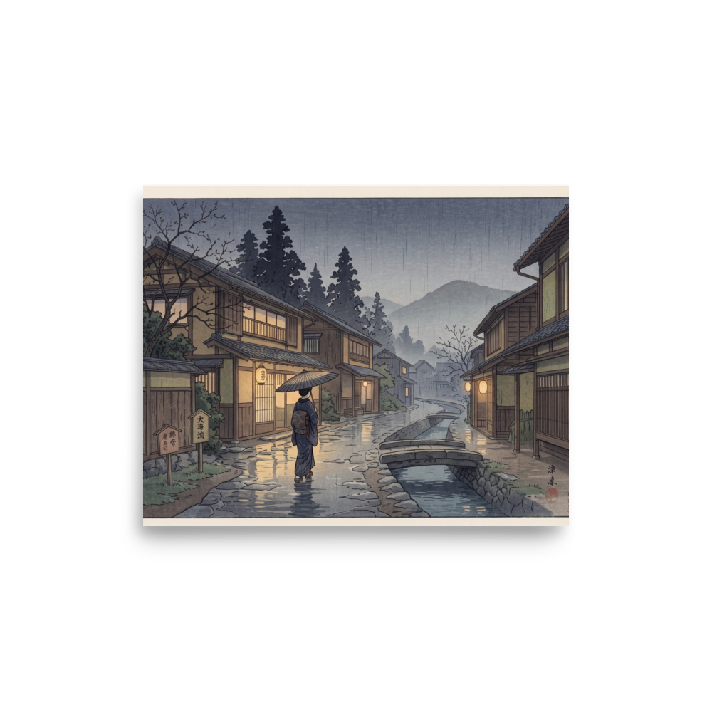 'Rain on Stone Street' — a Shin hanga print. A woman holding an umbrella walks down a rain-glistening cobblestone street beside a canal in a traditional Japanese village at twilight, perfect for a hallway.