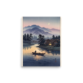'Moonlit River Crossing' — a Shin hanga print. A lone boatman rows across a calm river reflecting twilight colors and warm cabin window light beneath misty mountains, perfect for a living room.