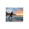 'Casting the Dawn' — a Art photography print. A dynamic photograph of a fisherman casting a circular net that catches golden sunrise light over the sea, ideal for a living room or study.