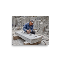 'Splitting the Stone'. A stonemason splits a granite slab with hammer and wedges in a quarry, offering grounded inspiration for an office. Offered as a Art photography print.