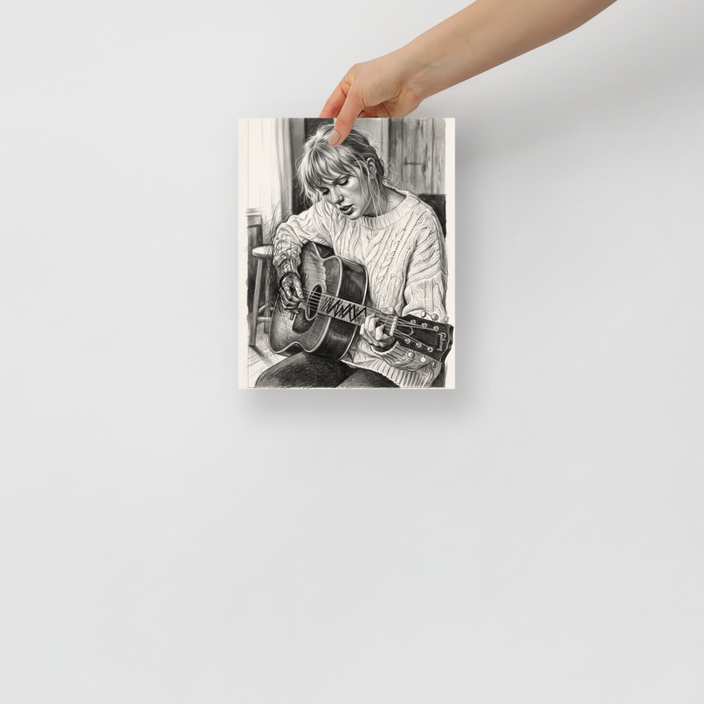 'Acoustic Reverie', a Realism wall art print. A detailed black and white pencil sketch of Taylor Swift playing an acoustic guitar in a cozy cable-knit sweater, ideal wall art for a calm bedroom.