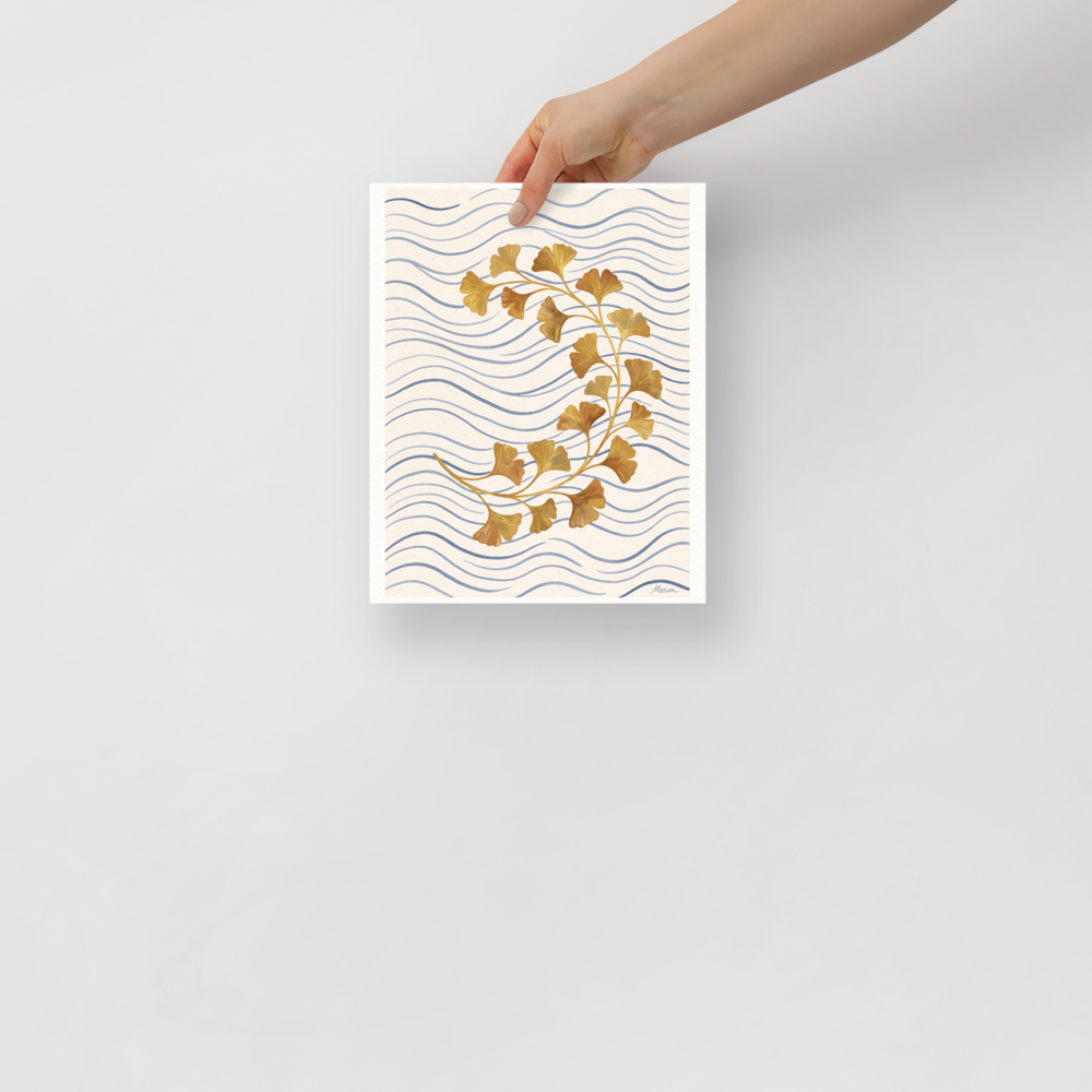 'Golden Ginkgo Breeze'. Curving golden ginkgo branch over soft blue wavy background lines on a beige backdrop, ideal for a bedroom. Offered as a Japanese art print.