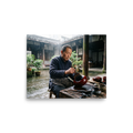 An artisan meticulously applies lacquer to a bowl in a rainy courtyard, offering inspiring dedication suited for an office. 'The Lacquer Craftsman', a Art photography print for the wall.