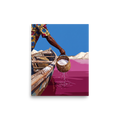 Wall art print 'Pink Lake Harvest' in a Figurative art style. Man in a floral shirt lifting a woven basket of salt from a bright pink lake into a wooden boat, perfect for a living room.
