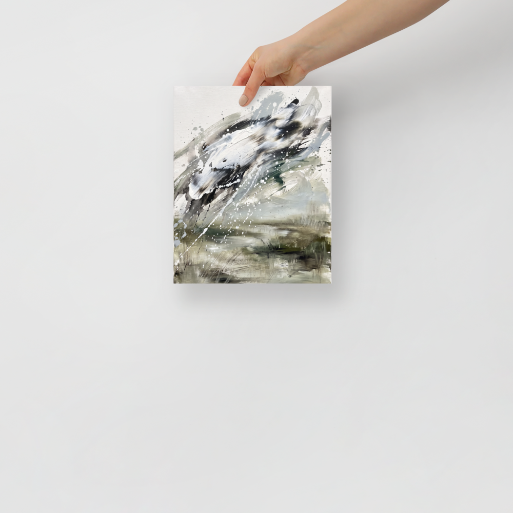 A chaotic scene in dark olive green and light slate gray, 'Tempest in Sage'. Dynamic abstract landscape print with impasto sage green and charcoal paint splatters styled in a modern living room.
