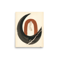 A minimalist abstract print of a terracotta arch enclosed by a black ink crescent, displayed in a calming meditation room. A Minimalism print in black and chocolate, 'Earthen Crescent'.