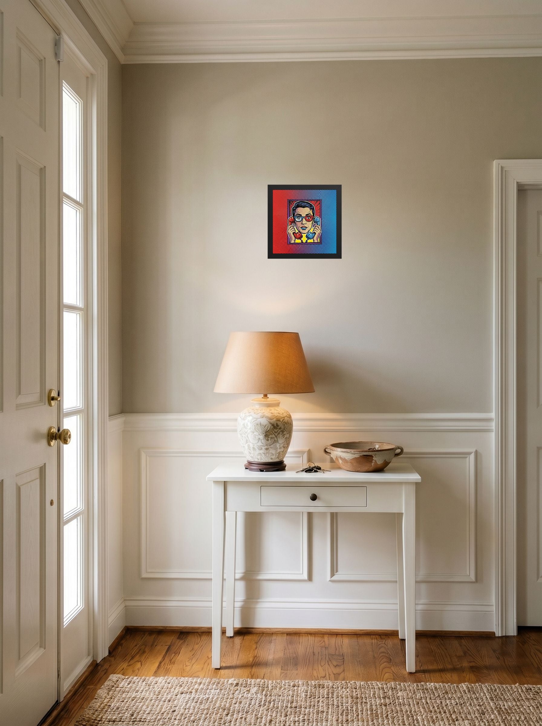 A 10x10 inch black framed Pop art print of 'Bipartisan Static' hanging in an entryway near a console.