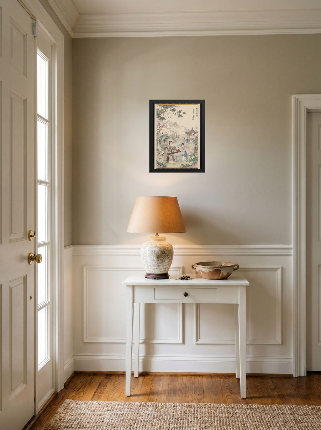 A 12x16 inch black framed Fine Art print of 'Melody in the Spring Garden' hanging in an entryway near a console.