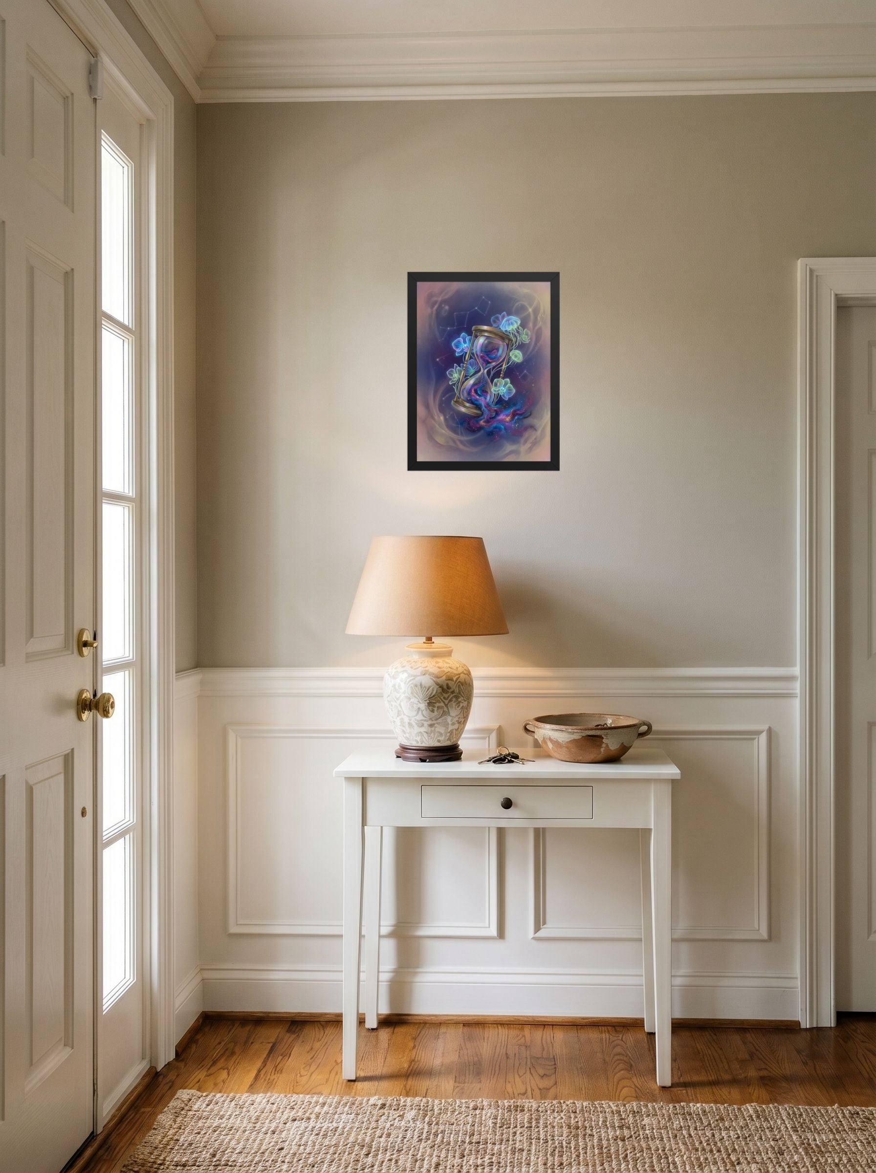A 12x16 inch black framed Magic realism print of 'Sands of the Nebula' hanging in an entryway near a console.