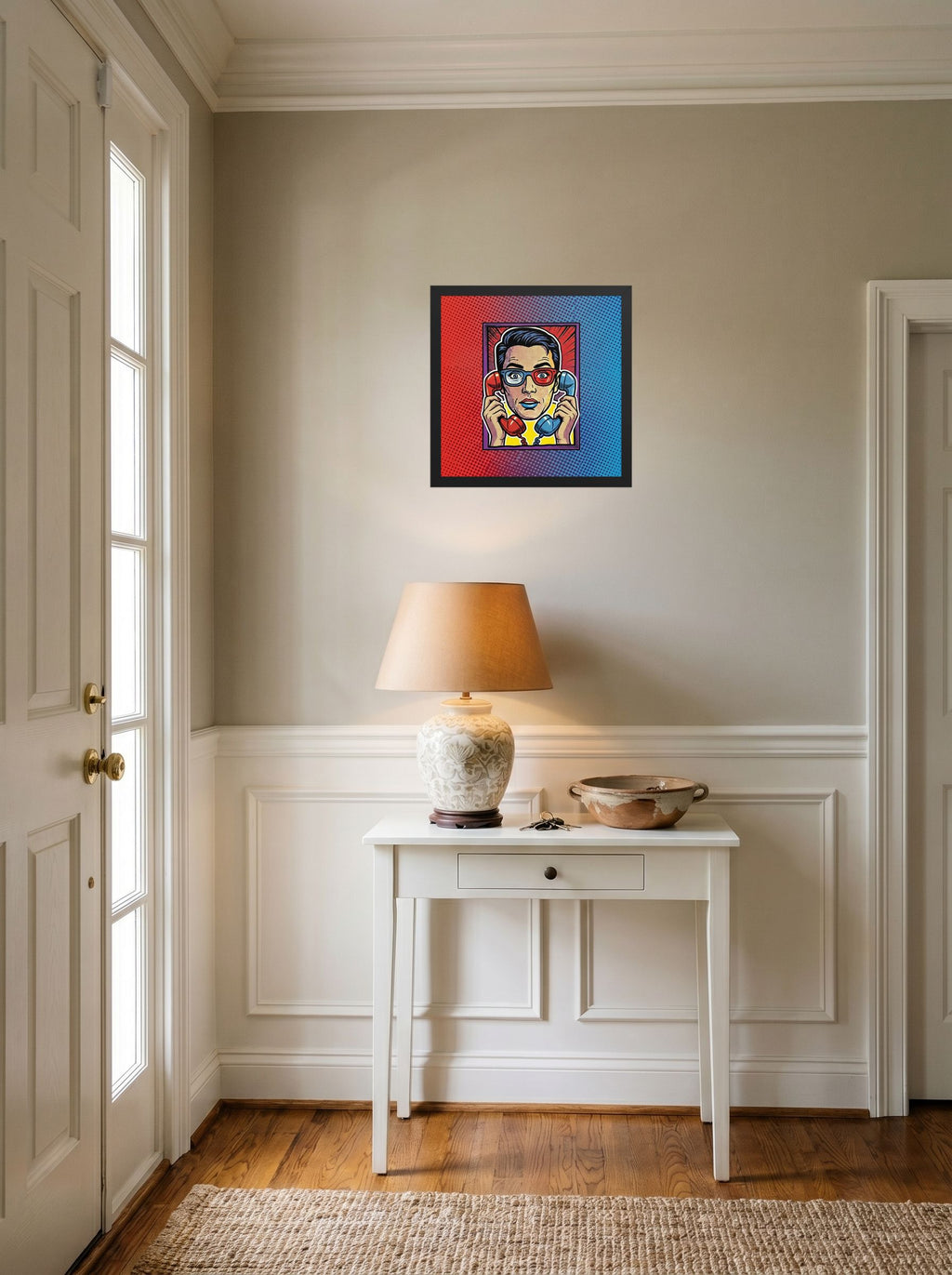 A 14x14 inch black framed Pop art print of 'Bipartisan Static' hanging in an entryway near a console.