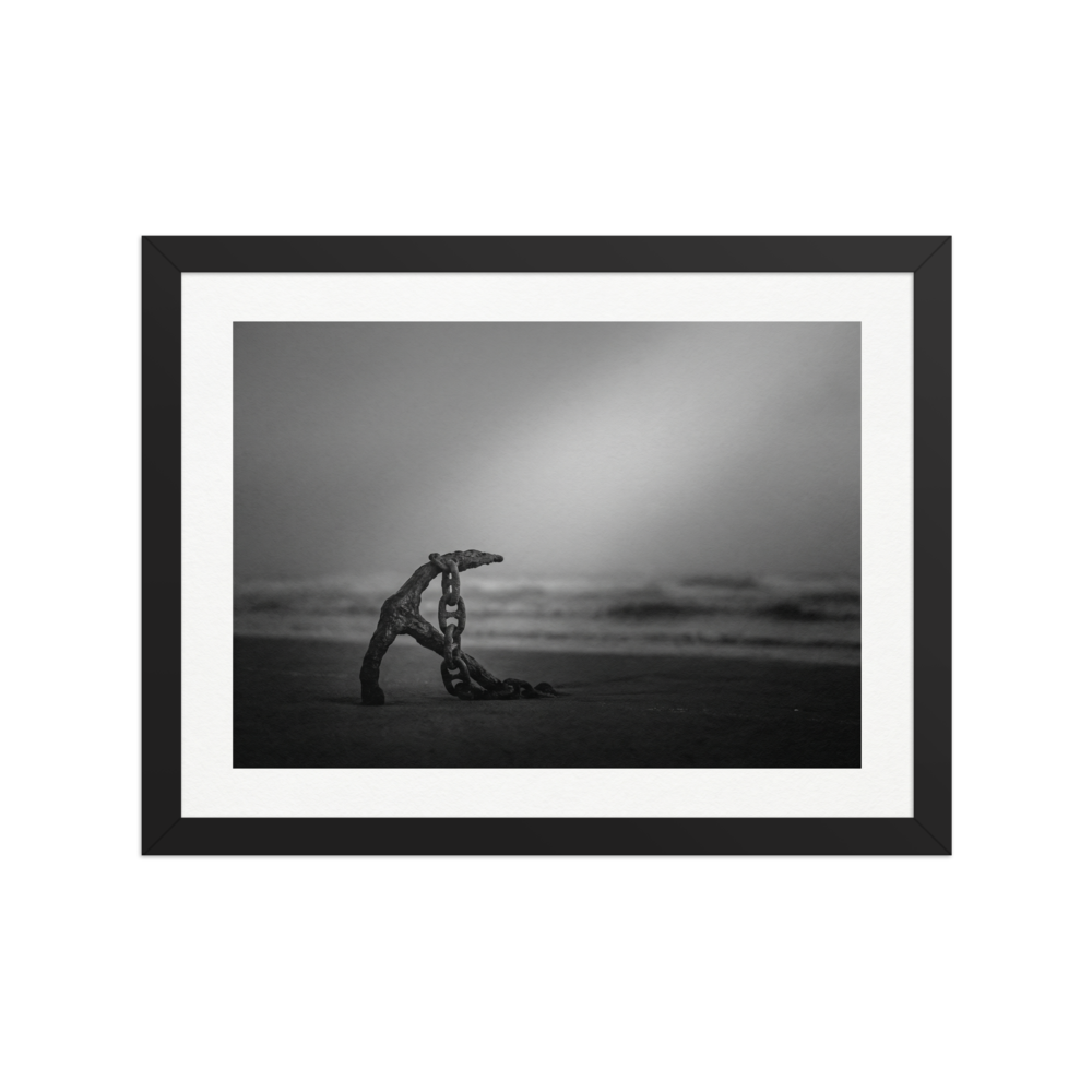 'The Old Anchor' — a Art photography print. A moody black and white photograph of an old rusted anchor and chain resting on a misty beach, a striking nautical piece for a Bathroom.