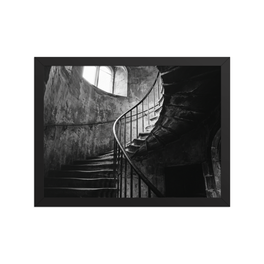 'Ascending Shadows' — a Art photography print. A black and white photograph of a winding stone staircase bathed in dramatic natural light, an elegant focal point for a Hallway.