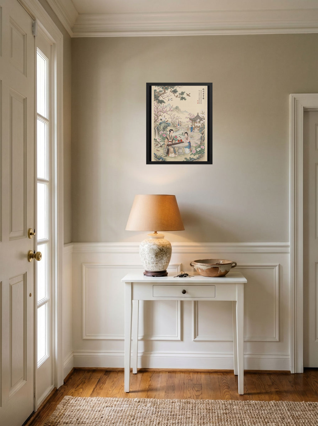 A 16x20 inch black framed Fine Art print of 'Melody in the Spring Garden' hanging in an entryway near a console.
