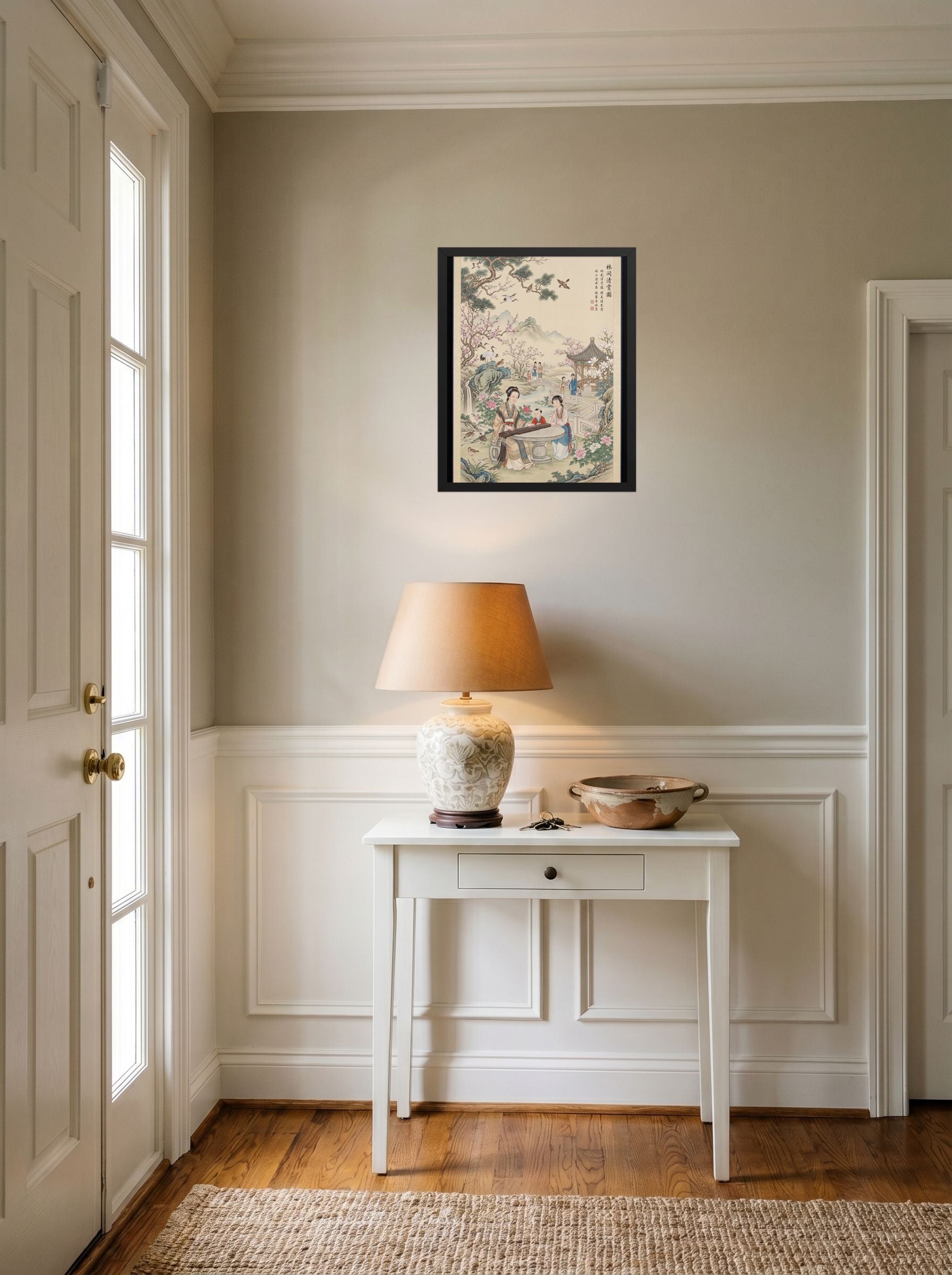 A 16x20 inch black framed Fine Art print of 'Melody in the Spring Garden' hanging in an entryway near a console.