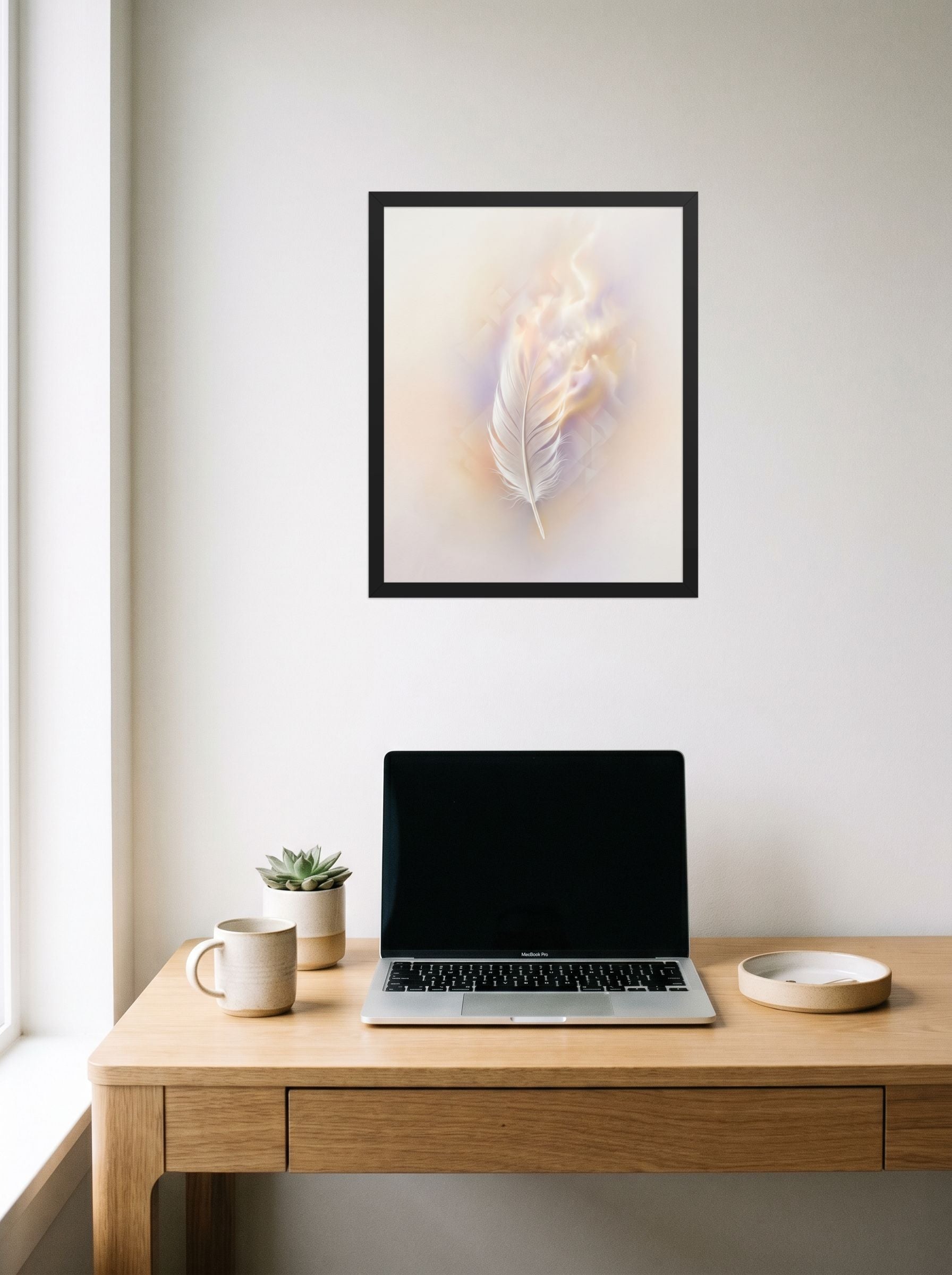 A 16x20 inch black framed Abstract art print of 'Ethereal Plume' hanging above a worktable with a laptop.