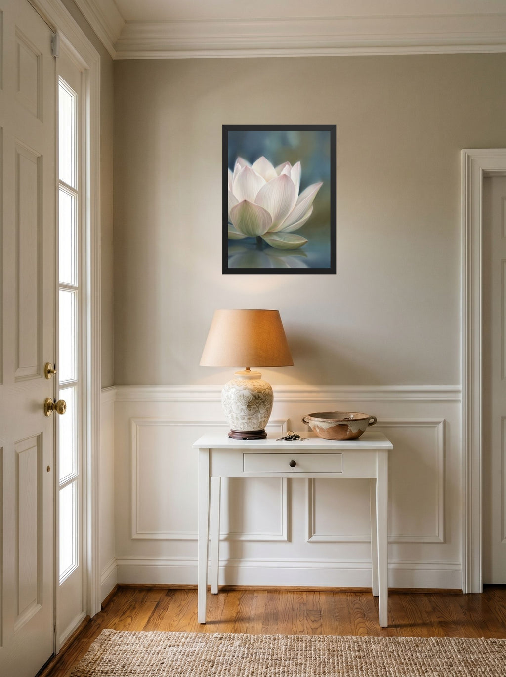 A 18x24 inch black framed Realism print of 'Serene Lotus Reflection' hanging in an entryway near a console.