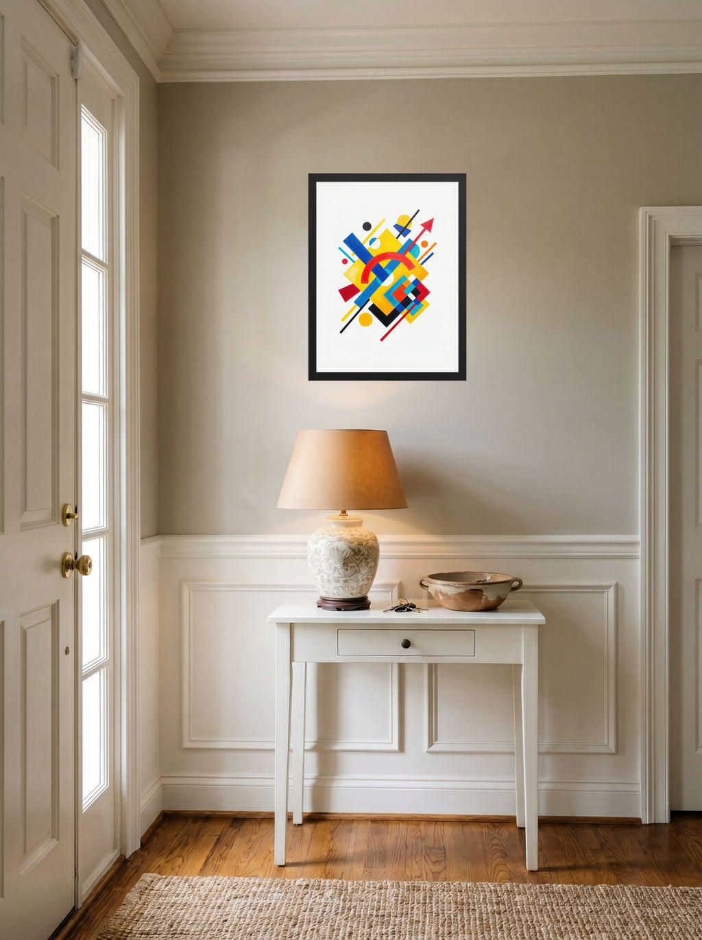 A 18x24 inch black framed Suprematism print of 'Directional Energy' hanging in an entryway near a console.