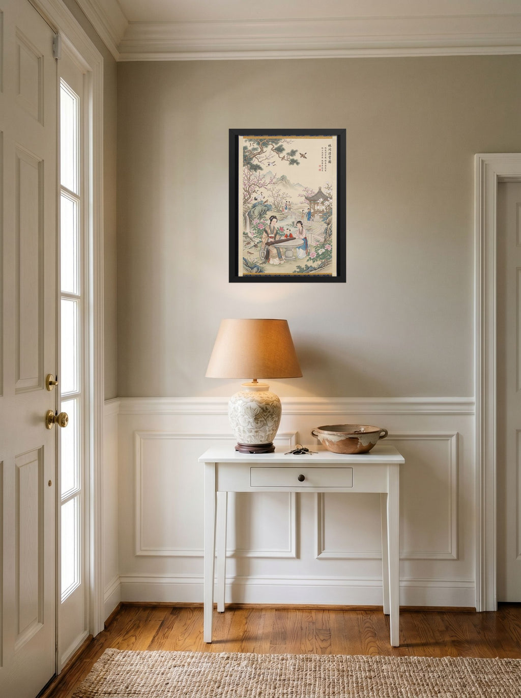A 18x24 inch black framed Fine Art print of 'Melody in the Spring Garden' hanging in an entryway near a console.