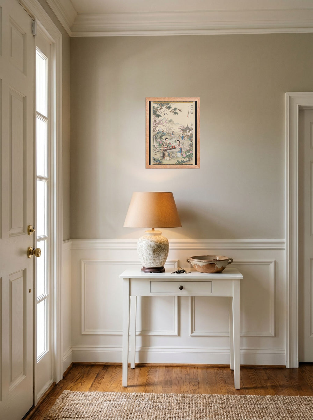 A 12x16 inch redoak framed Fine Art print of 'Melody in the Spring Garden' hanging in an entryway near a console.