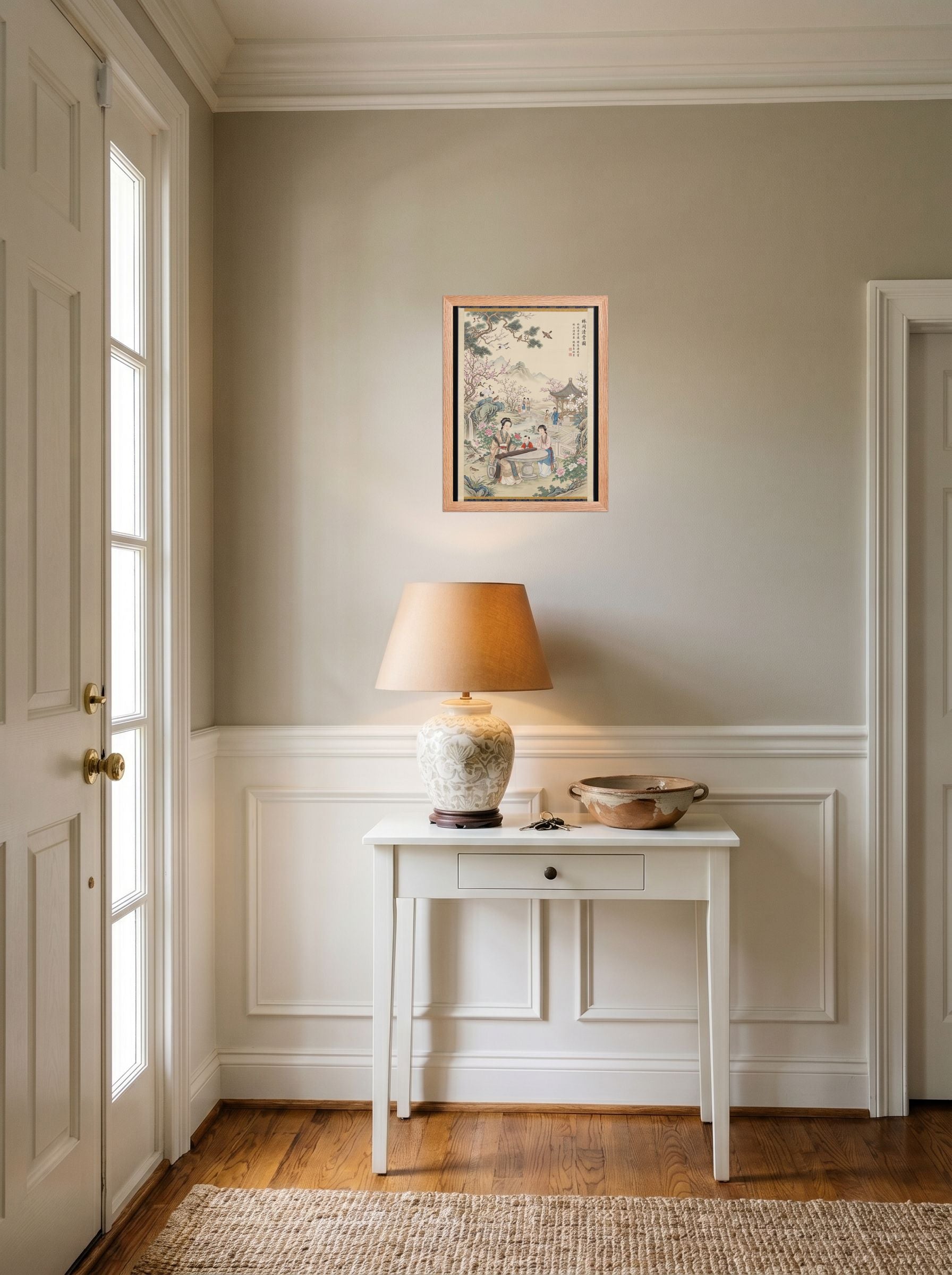 A 12x16 inch redoak framed Fine Art print of 'Melody in the Spring Garden' hanging in an entryway near a console.