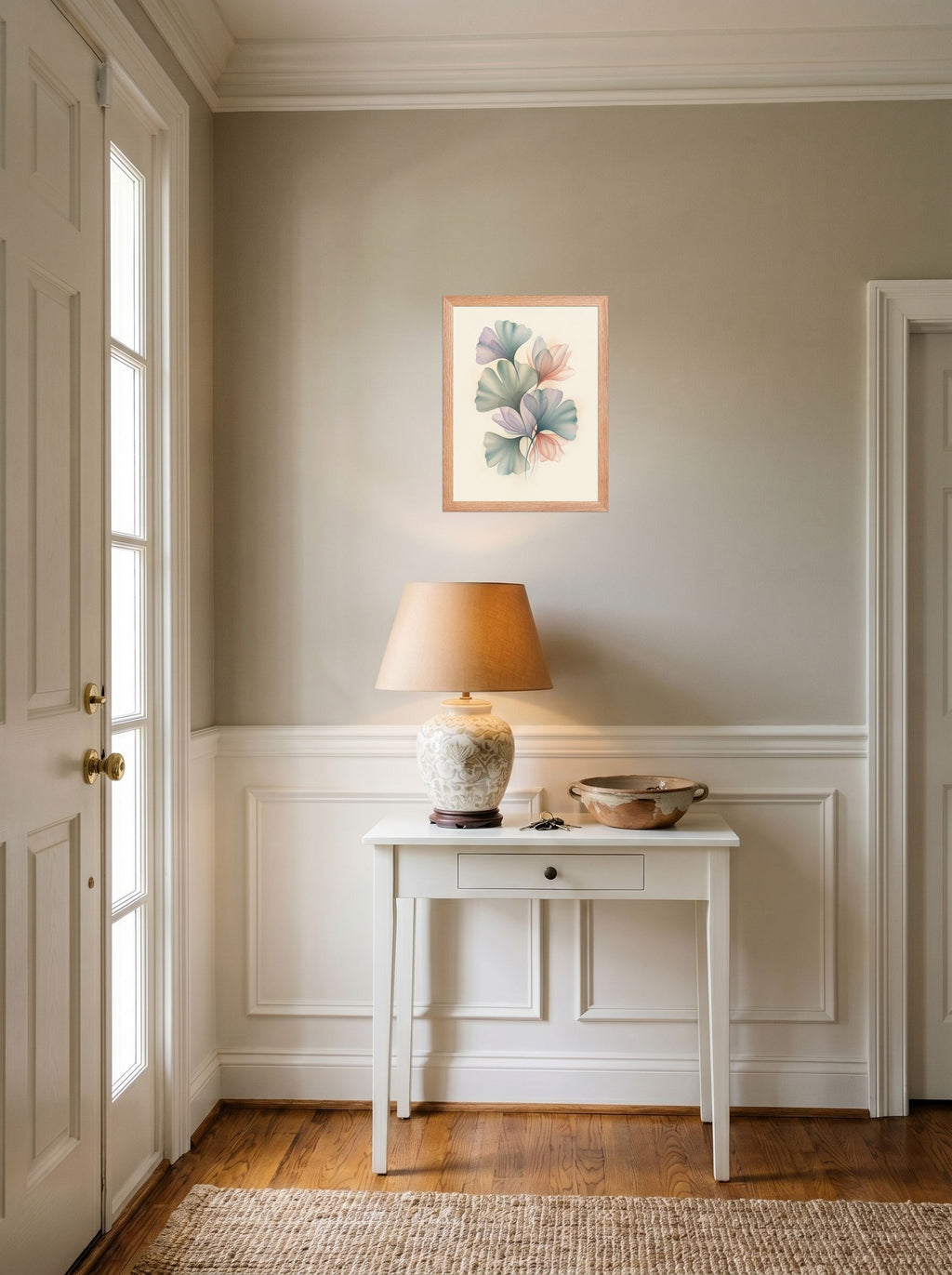 A 12x16 inch redoak framed Abstract art print of 'Ethereal Ginkgo Whispers' hanging in an entryway near a console.