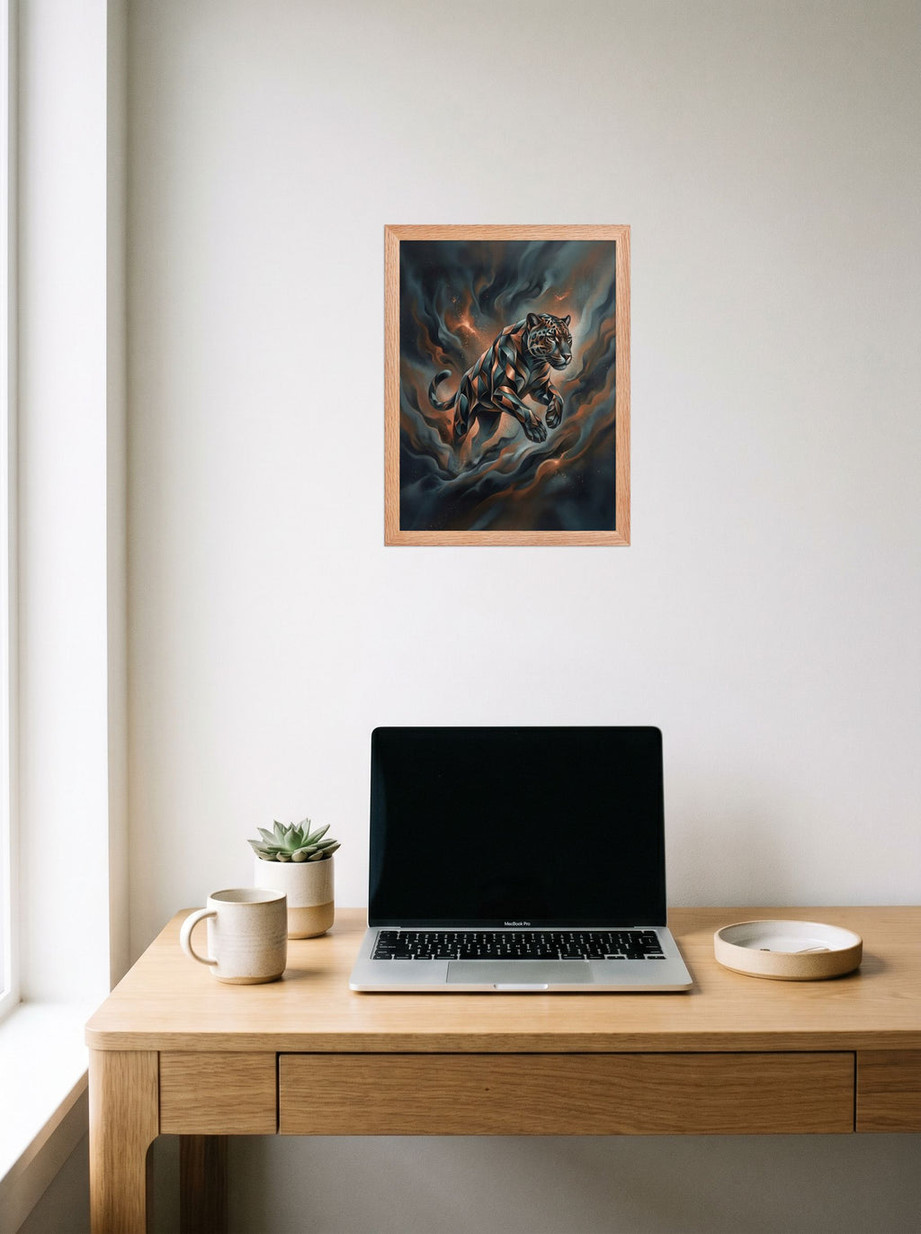 A 12x16 inch redoak framed Digital art print of 'Phantom Leap' hanging above a worktable with a laptop.