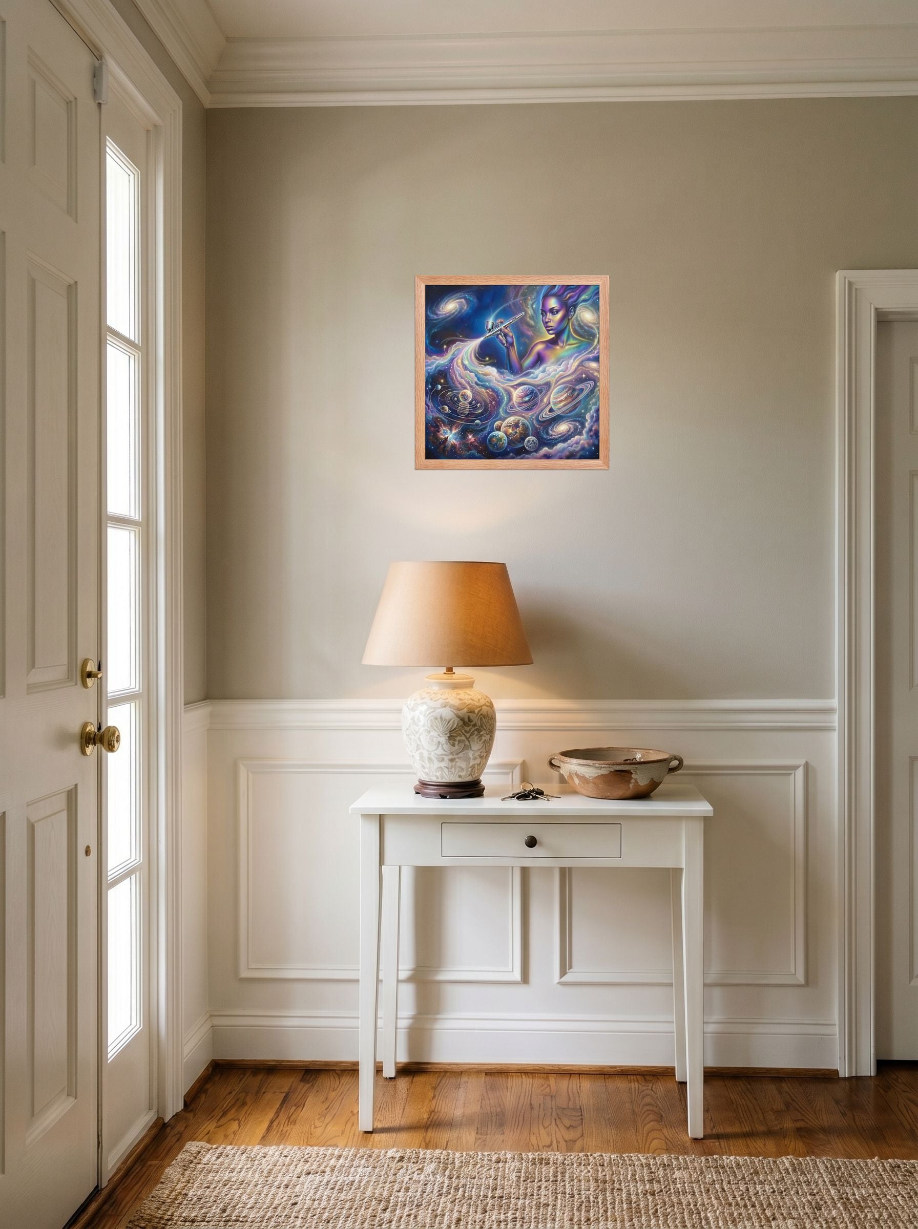 A 14x14 inch redoak framed Space art print of 'The Cosmic Painter' hanging in an entryway near a console.