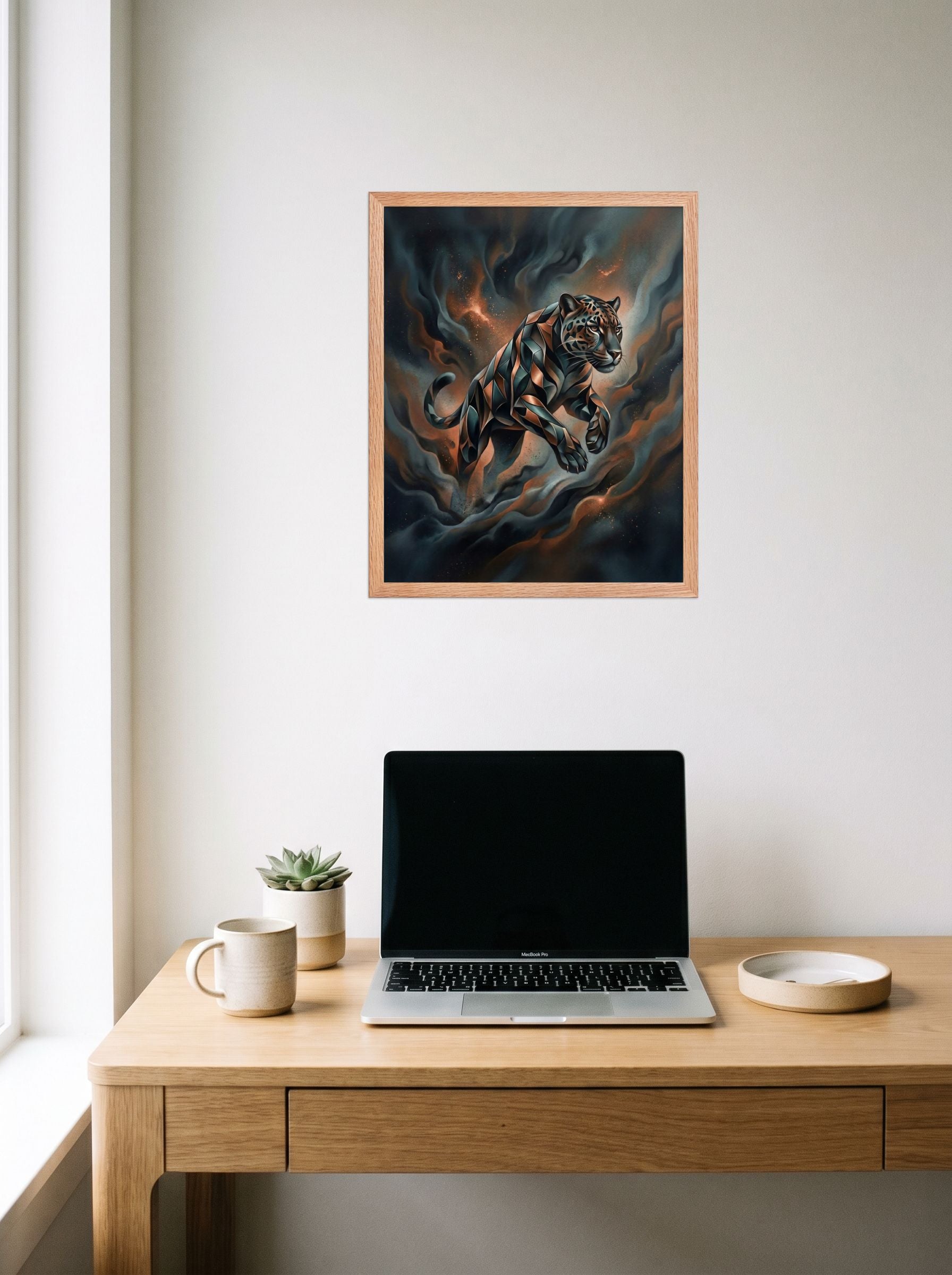A 16x20 inch redoak framed Digital art print of 'Phantom Leap' hanging above a worktable with a laptop.