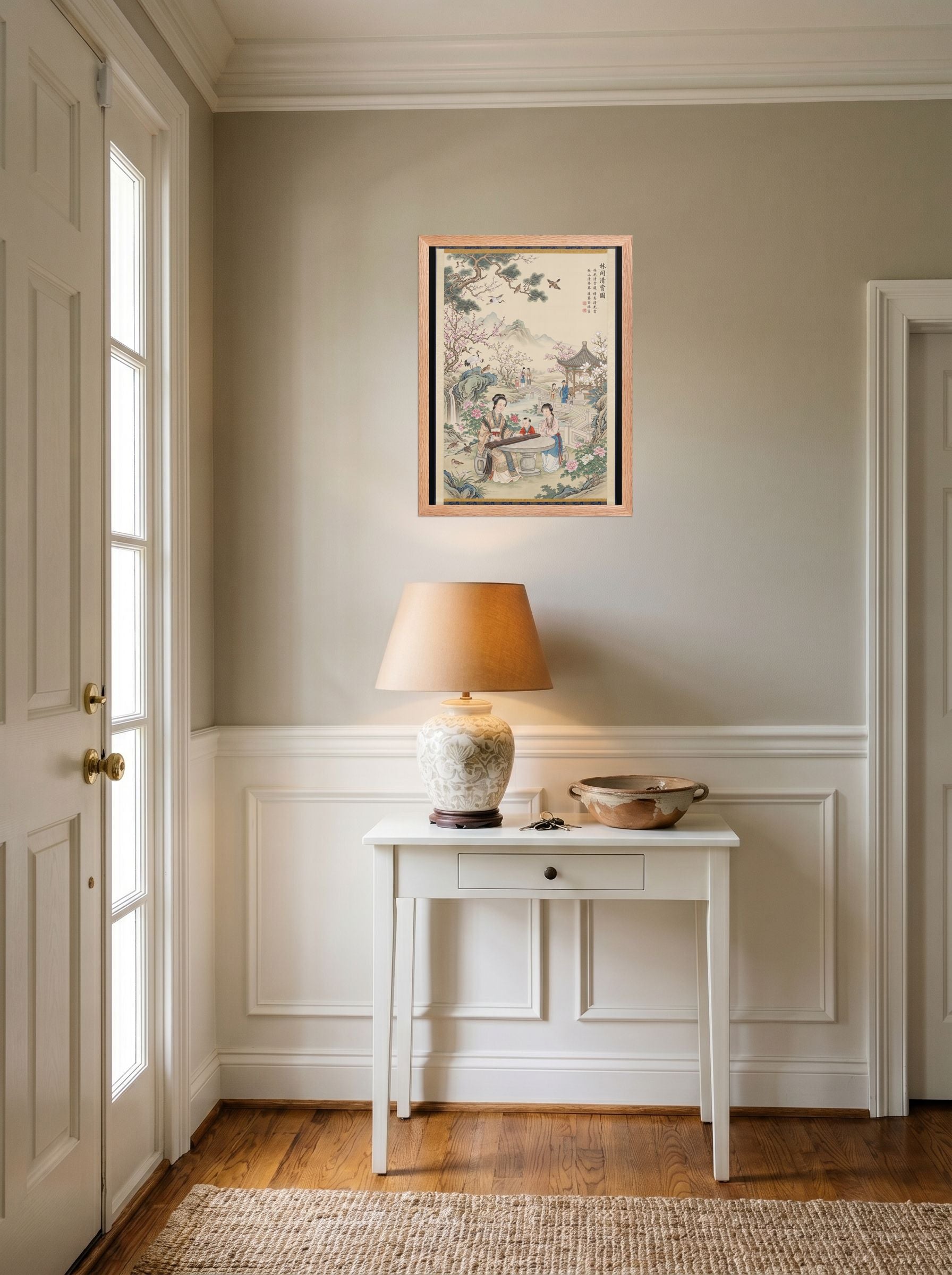 A 18x24 inch redoak framed Fine Art print of 'Melody in the Spring Garden' hanging in an entryway near a console.
