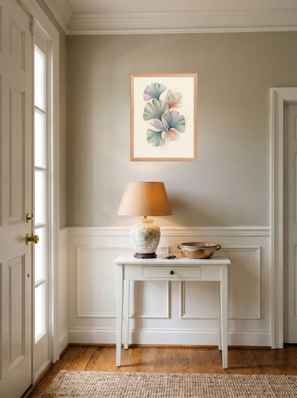 A 18x24 inch redoak framed Abstract art print of 'Ethereal Ginkgo Whispers' hanging in an entryway near a console.