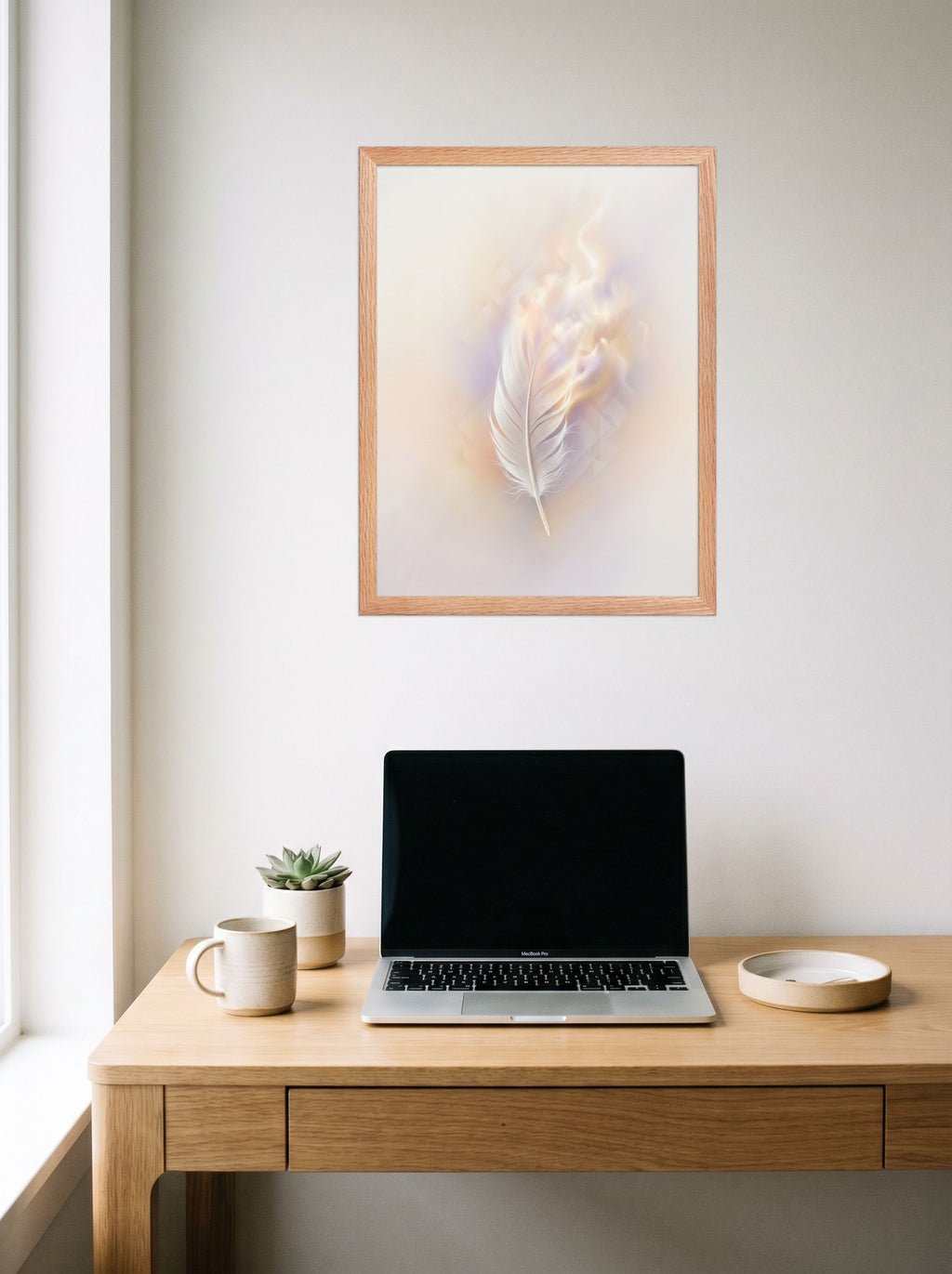 A 18x24 inch redoak framed Abstract art print of 'Ethereal Plume' hanging above a worktable with a laptop.