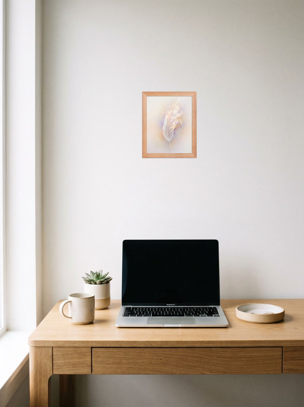 A 8x10 inch redoak framed Abstract art print of 'Ethereal Plume' hanging above a worktable with a laptop.