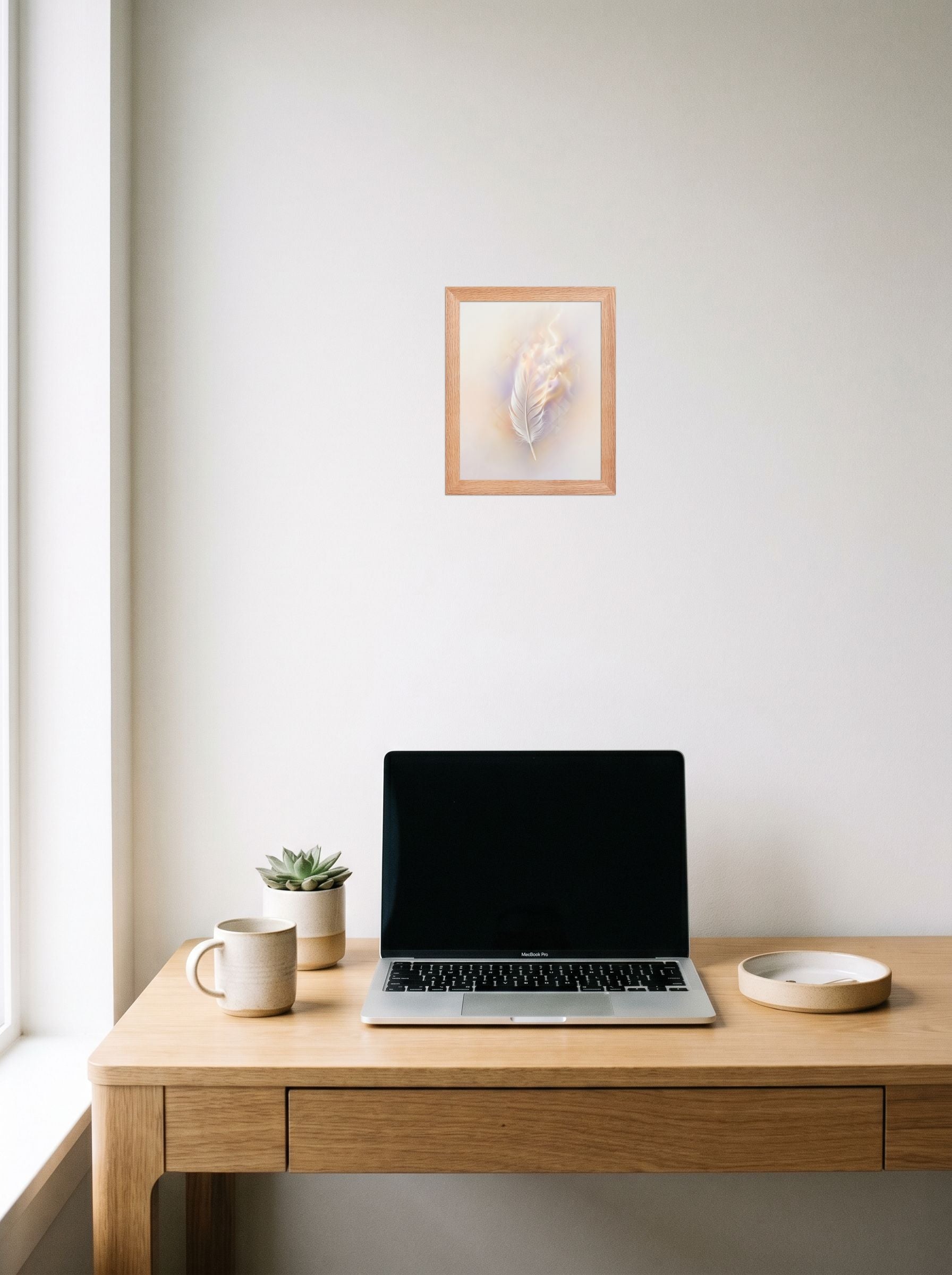 A 8x10 inch redoak framed Abstract art print of 'Ethereal Plume' hanging above a worktable with a laptop.