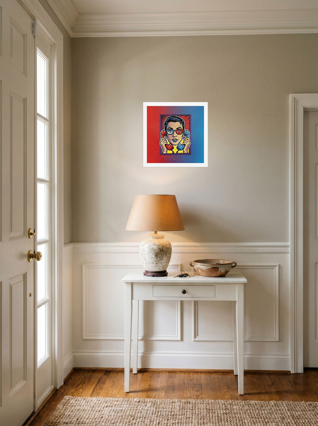A 12x12 inch white framed Pop art print of 'Bipartisan Static' hanging in an entryway near a console.