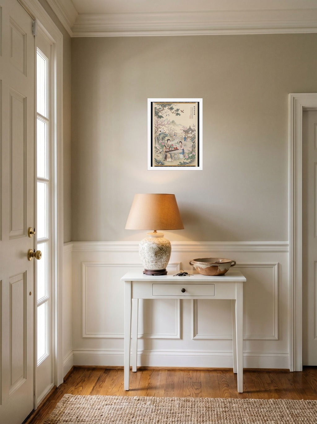 A 12x16 inch white framed Fine Art print of 'Melody in the Spring Garden' hanging in an entryway near a console.