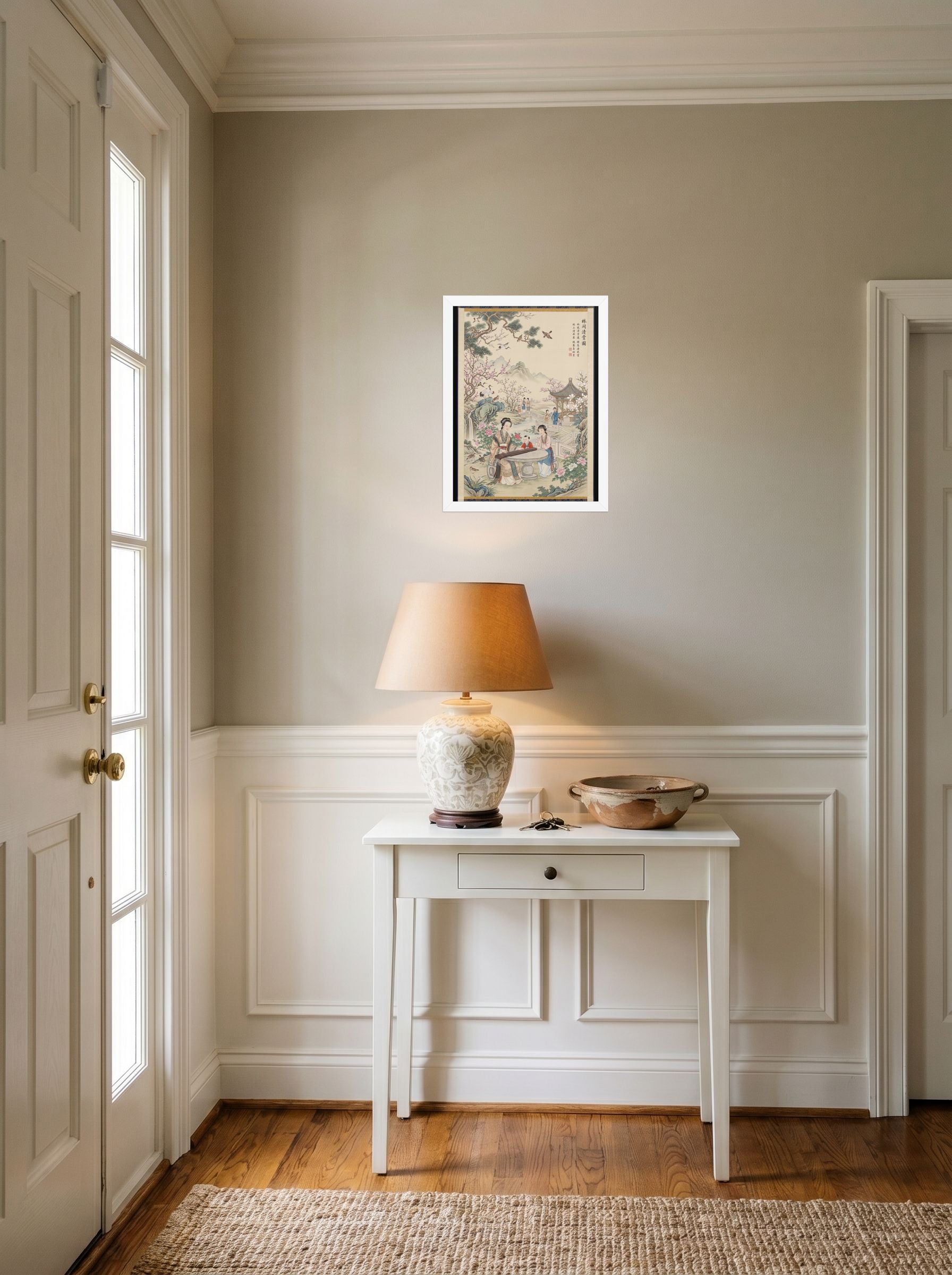 A 12x16 inch white framed Fine Art print of 'Melody in the Spring Garden' hanging in an entryway near a console.