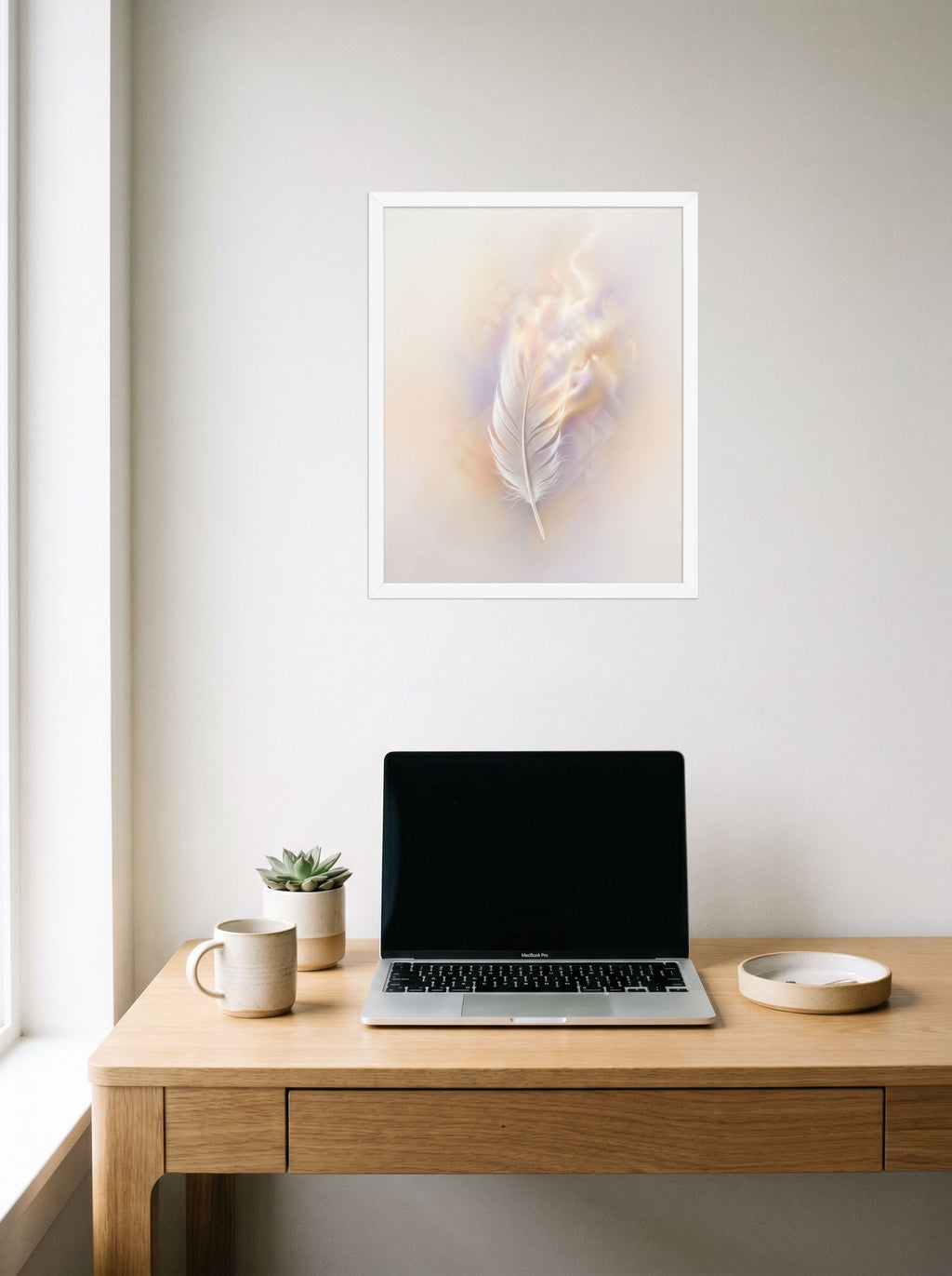A 16x20 inch white framed Abstract art print of 'Ethereal Plume' hanging above a worktable with a laptop.