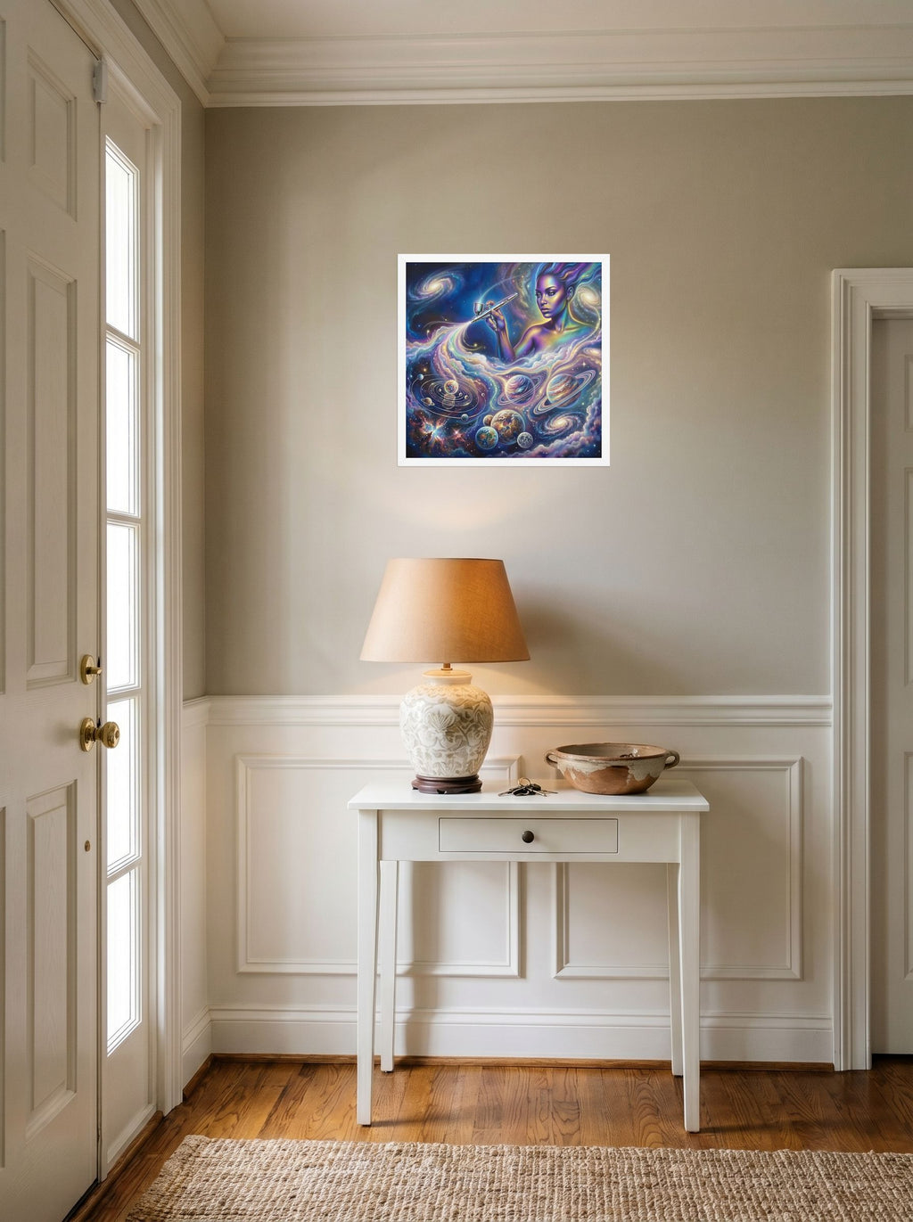 A 18x18 inch white framed Space art print of 'The Cosmic Painter' hanging in an entryway near a console.