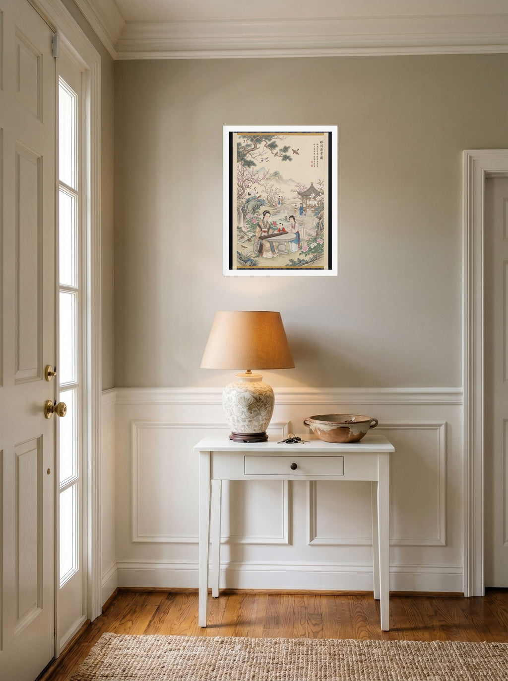 A 18x24 inch white framed Fine Art print of 'Melody in the Spring Garden' hanging in an entryway near a console.