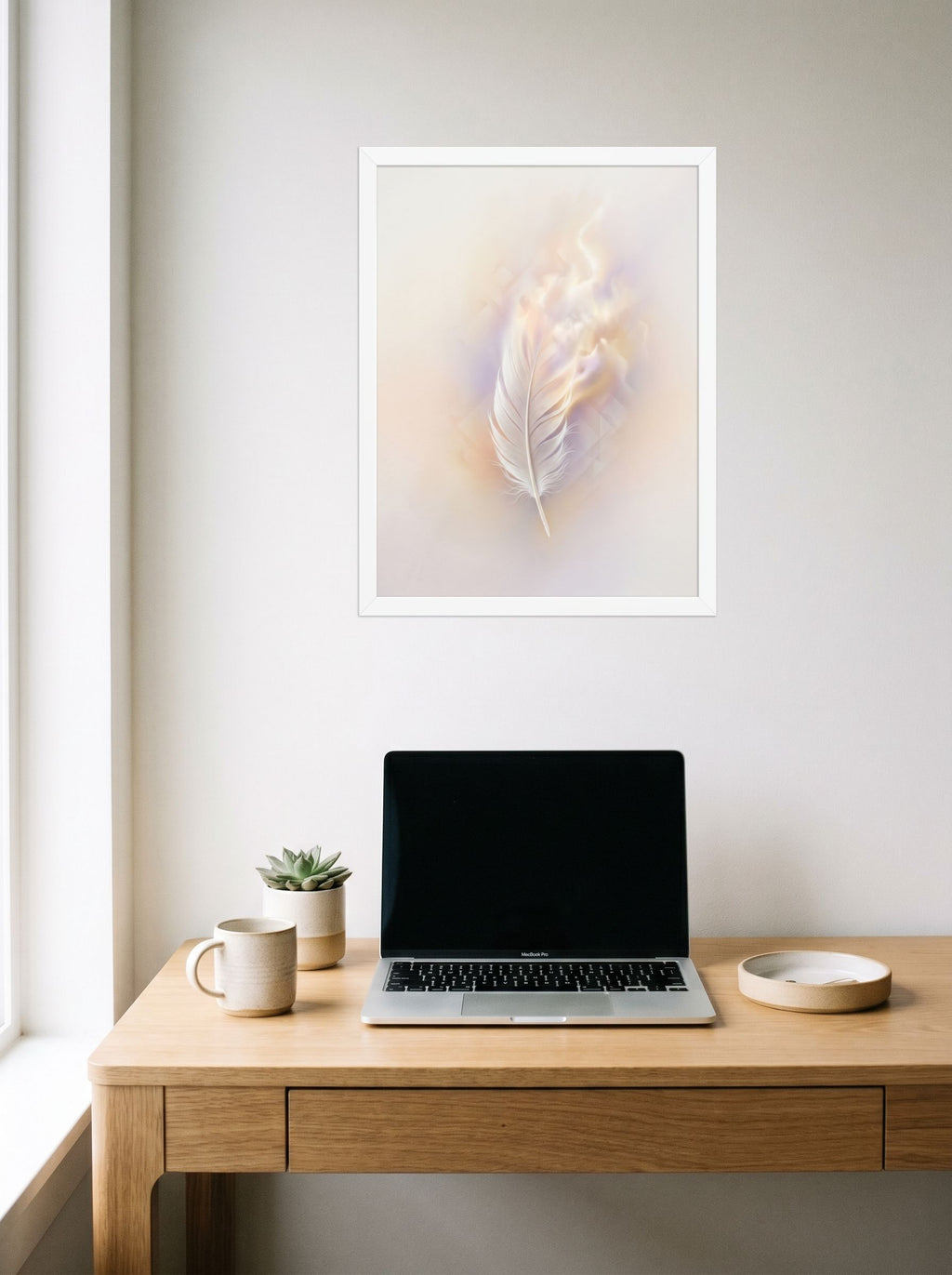 A 18x24 inch white framed Abstract art print of 'Ethereal Plume' hanging above a worktable with a laptop.