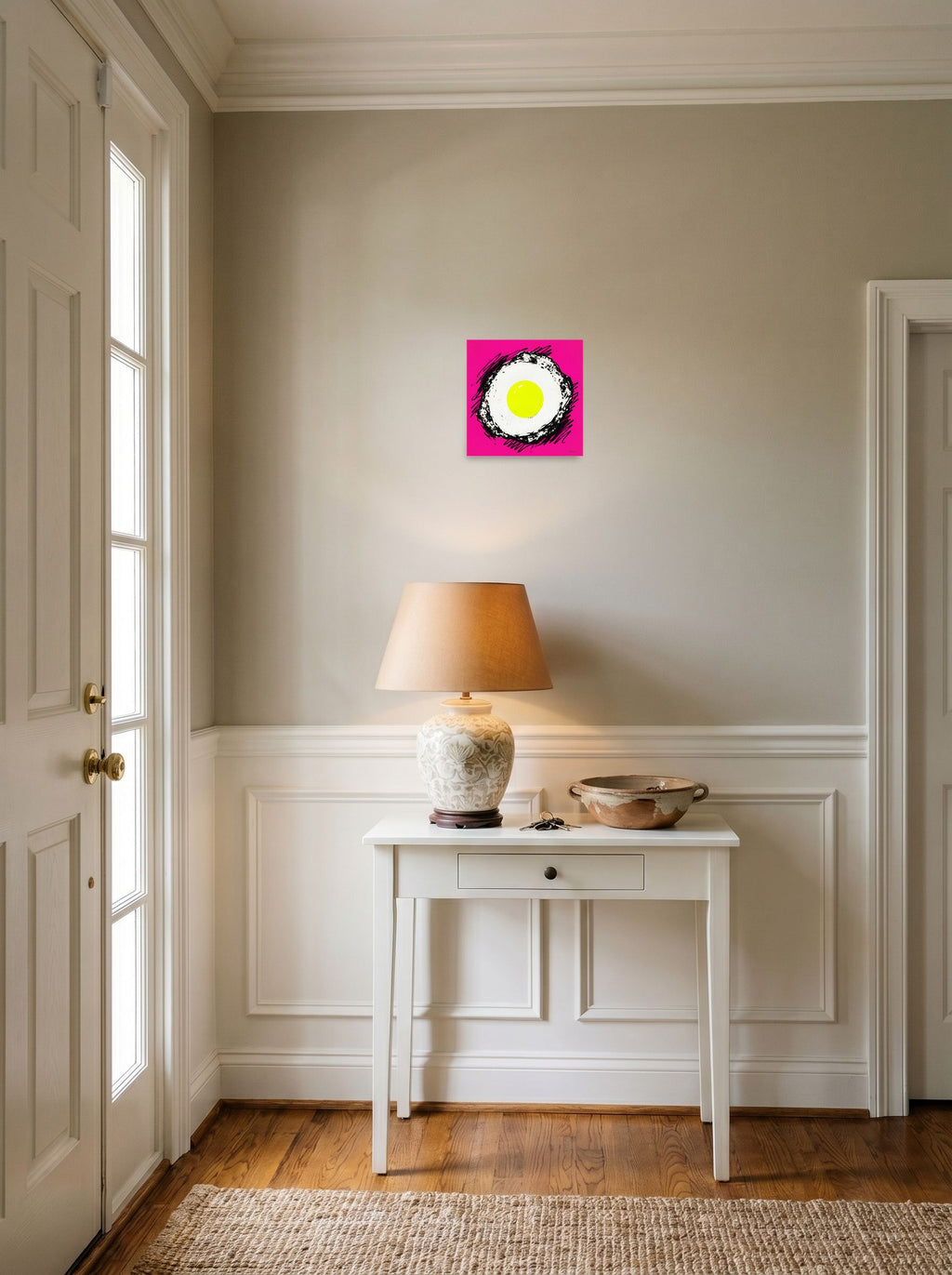 A 10x10 inch unframed paper Pop art print of 'Sunny Side Pop' hanging in an entryway near a console.