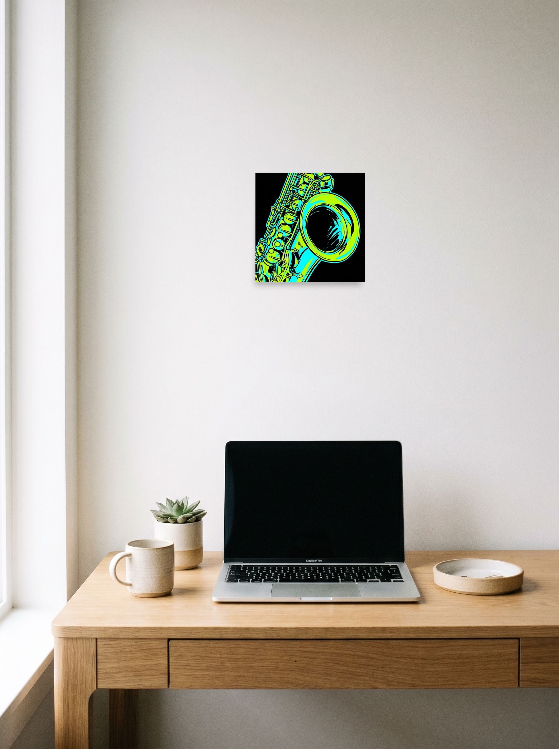 A 10x10 inch unframed paper Pop art print of 'Neon Rhythms' hanging above a worktable with a laptop.