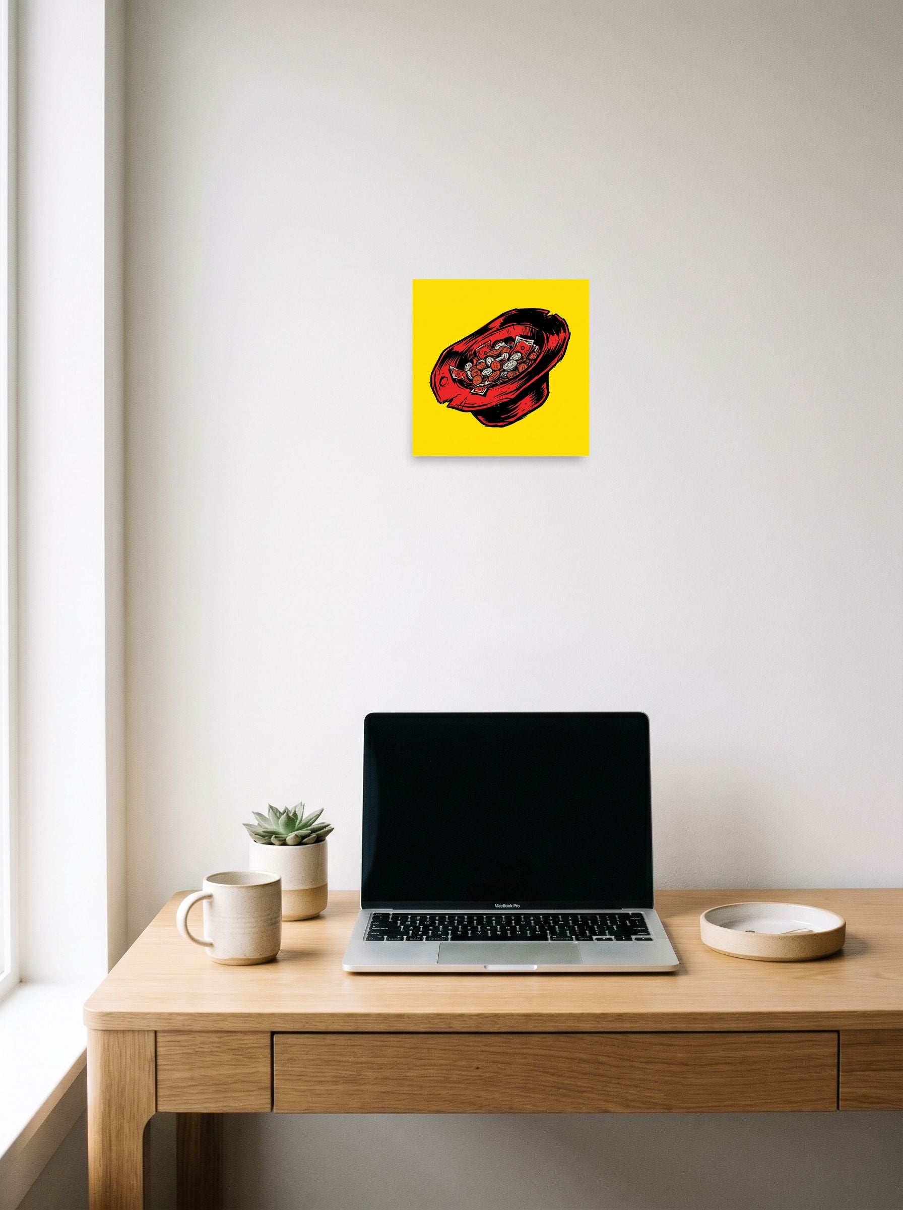 A 10x10 inch unframed paper Pop art print of 'The Busker's Fortune' hanging above a worktable with a laptop.