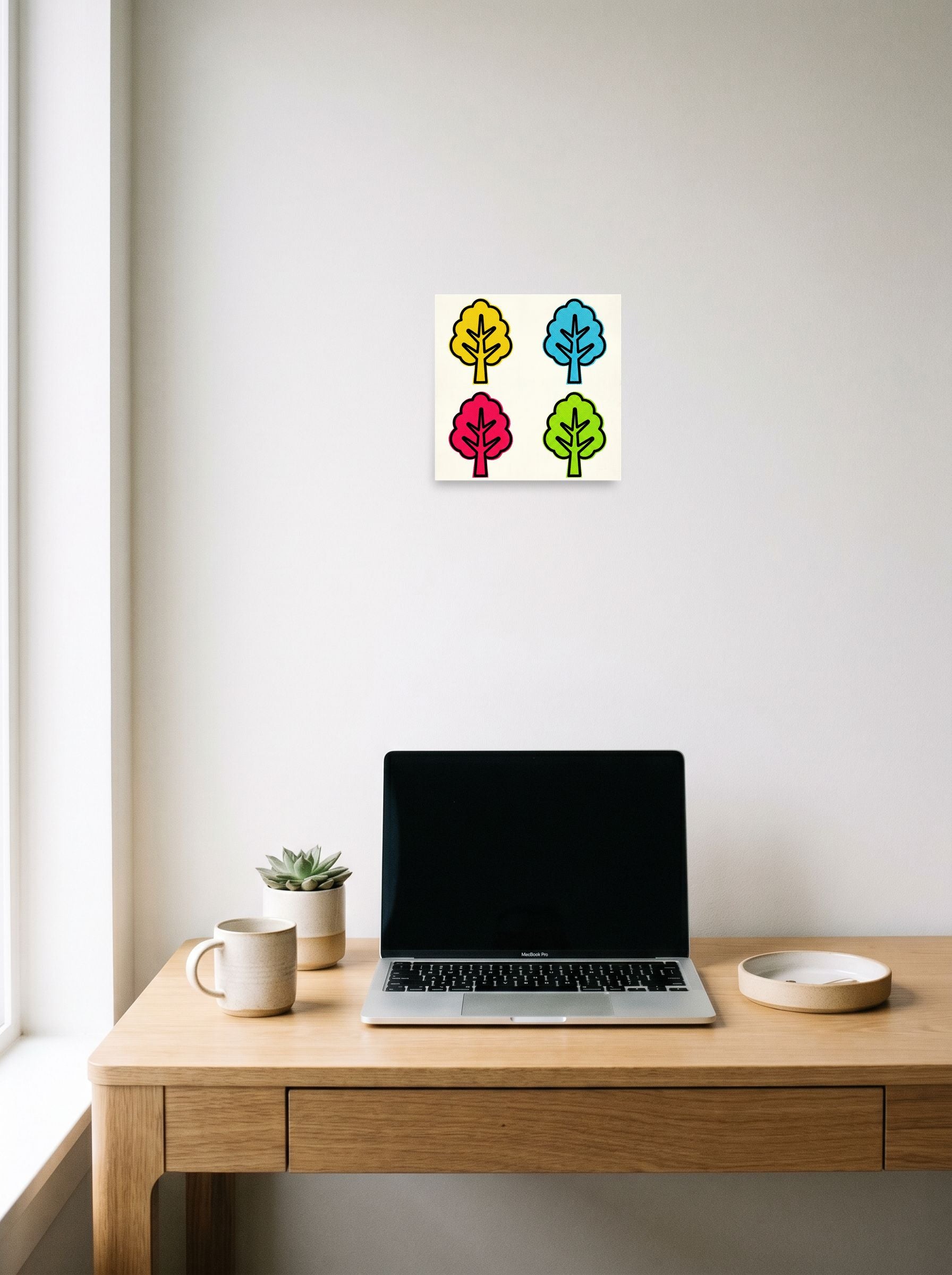 A 10x10 inch unframed paper Pop art print of 'Pop Art Forest Grid' hanging above a worktable with a laptop.