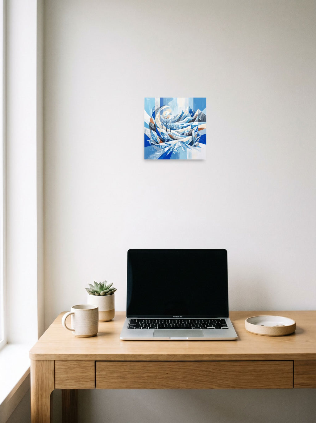 A 10x10 inch unframed paper version of 'Crystalline Alpine Haven', Crystal Cubism wall art, displayed over a compact desk setup.