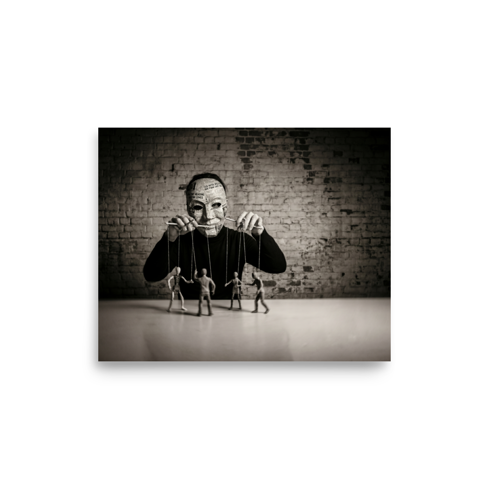 'The Puppeteer of News' — a Surrealism print. Conceptual sepia photograph of a person in a newspaper mask acting as a puppeteer, controlling small human figures on strings against a brick wall, ideal for a moody den or office.